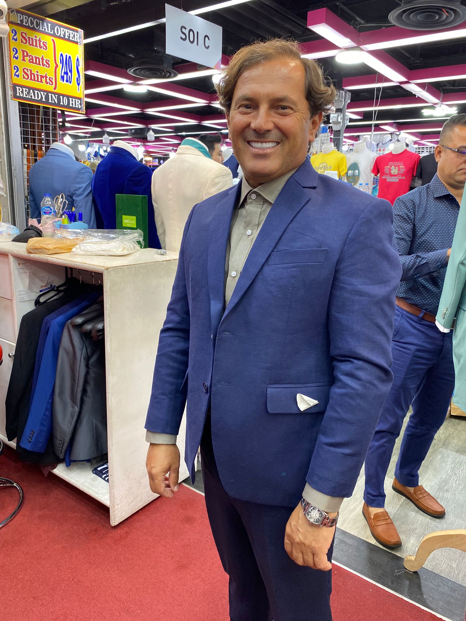 Happy client in custom tailored suit at King Fashion Uni Bangkok